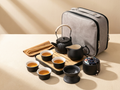 Everything in the Wrenly gongfu travel set: teapot, four cups, gongdao, canister, strainer, bamboo tongs, tea towel, bamboo tray and grey travel case